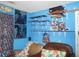 Themed bedroom with wall decor and shelving at 770 Starrsville Rd, Covington, GA 30014