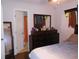 Bedroom features a large dresser with mirror and an entry to the bathroom at 770 Starrsville Rd, Covington, GA 30014