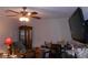 Bonus room features a ceiling fan and a television at 770 Starrsville Rd, Covington, GA 30014