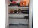 Organized closet with shelving and hanging space for storage and display of items at 770 Starrsville Rd, Covington, GA 30014