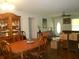 Traditional dining room featuring hardwood floors, ceiling fan, and large china cabinet at 770 Starrsville Rd, Covington, GA 30014