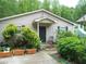 Charming one story home with a cozy front porch and landscaped yard at 770 Starrsville Rd, Covington, GA 30014