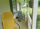 Cozy front porch with chairs, hanging plants, and views of the landscaped yard at 770 Starrsville Rd, Covington, GA 30014