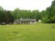 Charming ranch-style home with a welcoming front porch and spacious, lush front lawn at 770 Starrsville Rd, Covington, GA 30014