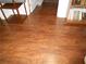 Hallway with beautiful wood-look laminate flooring and classic trim at 770 Starrsville Rd, Covington, GA 30014