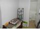 Hallway with a bathroom in the distance and cleaning supplies at 770 Starrsville Rd, Covington, GA 30014