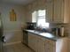 Bright kitchen features white cabinets, granite countertops, and modern appliances at 770 Starrsville Rd, Covington, GA 30014