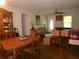 Warm and inviting living room and dining area with hardwood floors and natural light at 770 Starrsville Rd, Covington, GA 30014