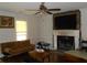 Cozy living room with a fireplace and large TV at 770 Starrsville Rd, Covington, GA 30014