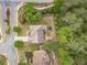 An aerial view of the home showcasing the well-maintained backyard with mature trees and landscaping at 882 Nestling Dr, Lawrenceville, GA 30045