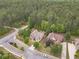 An aerial view of the neighborhood showcasing mature trees and manicured lawns at 882 Nestling Dr, Lawrenceville, GA 30045