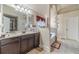 Elegant bathroom with dual sinks, soaking tub, walk-in shower, and designer finishes at 882 Nestling Dr, Lawrenceville, GA 30045