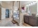 Dual sink bathroom featuring a separate soaking tub and easy access to the home gym at 882 Nestling Dr, Lawrenceville, GA 30045