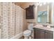 Well-lit bathroom featuring a shower, vanity, and medicine cabinet at 882 Nestling Dr, Lawrenceville, GA 30045