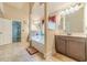 Bathroom displaying a tub, vanity, and tiled floors with great natural light at 882 Nestling Dr, Lawrenceville, GA 30045