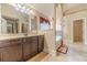 Bright bathroom featuring a double vanity, large tub, and glass-enclosed shower at 882 Nestling Dr, Lawrenceville, GA 30045