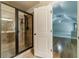 Bathroom featuring a glass shower door and an open doorway into a bedroom at 882 Nestling Dr, Lawrenceville, GA 30045