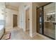 Bathroom showcasing a sleek glass shower, tiled floors, and neutral color palette at 882 Nestling Dr, Lawrenceville, GA 30045
