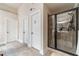 Modern bathroom featuring a glass-enclosed shower with modern fixtures, a seat, and a hand shower at 882 Nestling Dr, Lawrenceville, GA 30045