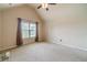Spacious bedroom with vaulted ceiling, ceiling fan, and window with natural light at 882 Nestling Dr, Lawrenceville, GA 30045