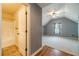 View into the upstairs bedroom with neutral carpet and gray walls from the bathroom hallway at 882 Nestling Dr, Lawrenceville, GA 30045