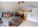 A bedroom showcasing a unique basketball theme decor, ceiling fan, and carpet flooring at 882 Nestling Dr, Lawrenceville, GA 30045