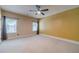 Bright bedroom with natural light, neutral carpet, and warm yellow walls at 882 Nestling Dr, Lawrenceville, GA 30045