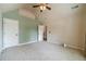Bright bedroom with high ceilings, neutral walls and access to a hallway at 882 Nestling Dr, Lawrenceville, GA 30045