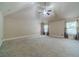 Large upstairs bonus room with high ceilings and lots of natural light at 882 Nestling Dr, Lawrenceville, GA 30045