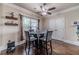 Cozy dining area with a glass table, comfortable seating, and elegant decor at 882 Nestling Dr, Lawrenceville, GA 30045