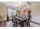 Elegant dining room with coffered ceilings, chandelier, and hardwood floors at 882 Nestling Dr, Lawrenceville, GA 30045