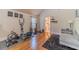 Bright workout area with hardwood floors, exercise equipment, and easy access to the bathroom at 882 Nestling Dr, Lawrenceville, GA 30045