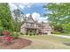 Brick two-story home featuring a two-car garage and well-maintained lawn and landscaping at 882 Nestling Dr, Lawrenceville, GA 30045