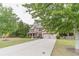 Well-maintained two-story brick home features an attached two-car garage and long driveway at 882 Nestling Dr, Lawrenceville, GA 30045