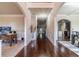 Elegant foyer with hardwood floors, arched doorways, and decorative wainscoting at 882 Nestling Dr, Lawrenceville, GA 30045