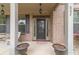 Charming front porch with brick facade, decorative planters, and an inviting entrance at 882 Nestling Dr, Lawrenceville, GA 30045