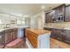 Well-appointed kitchen featuring custom cabinets, granite countertops, and stainless steel appliances at 882 Nestling Dr, Lawrenceville, GA 30045
