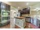 Gourmet kitchen with a center island, stainless steel appliances, and hardwood floors at 882 Nestling Dr, Lawrenceville, GA 30045