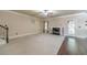 Open-concept living room with fireplace, carpeted area, and hardwood flooring at 882 Nestling Dr, Lawrenceville, GA 30045