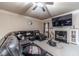 Comfortable living room featuring a fireplace, a large TV, and a stylish sectional sofa at 882 Nestling Dr, Lawrenceville, GA 30045