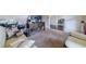 Comfortable living room featuring neutral decor, large windows, and working space at 882 Nestling Dr, Lawrenceville, GA 30045