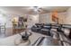 Inviting living room showcases a sectional sofa, coffee table, and seamless flow to kitchen at 882 Nestling Dr, Lawrenceville, GA 30045