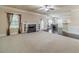 Inviting living room with a fireplace, neutral carpet, wood flooring, and lots of natural light at 882 Nestling Dr, Lawrenceville, GA 30045