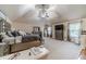 Spacious carpeted main bedroom featuring vaulted ceilings and a ceiling fan for added comfort at 882 Nestling Dr, Lawrenceville, GA 30045