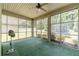 Relaxing screened porch with ceiling fan, and large windows overlooking private backyard at 882 Nestling Dr, Lawrenceville, GA 30045