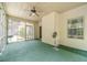 Relaxing screened-in porch with green carpet and wooded views at 882 Nestling Dr, Lawrenceville, GA 30045