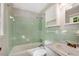 Bathroom with a green tiled shower, a bathtub and a sink at 1055 Heather Ct, Lawrenceville, GA 30043