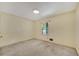 A bright bedroom featuring carpet, a window and neutral-painted walls at 1055 Heather Ct, Lawrenceville, GA 30043