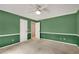 Bright bedroom with ceiling fan, neutral carpet, and fresh paint awaiting your personal touch at 1055 Heather Ct, Lawrenceville, GA 30043