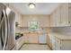Traditional kitchen with stainless steel appliances and bright cabinets at 1055 Heather Ct, Lawrenceville, GA 30043